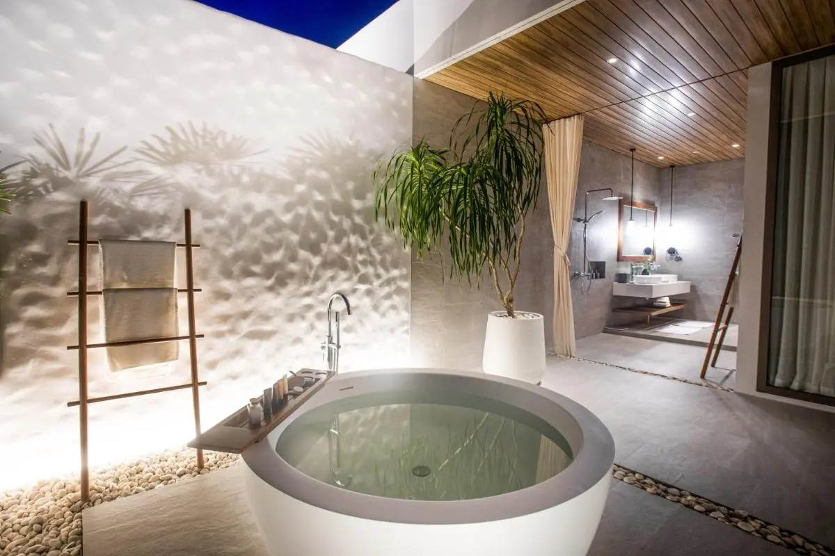 Modern Minimalist Bathroom Featuring Circular Freestanding Bathtub and Walk-In Shower Near Mai Khao Beach