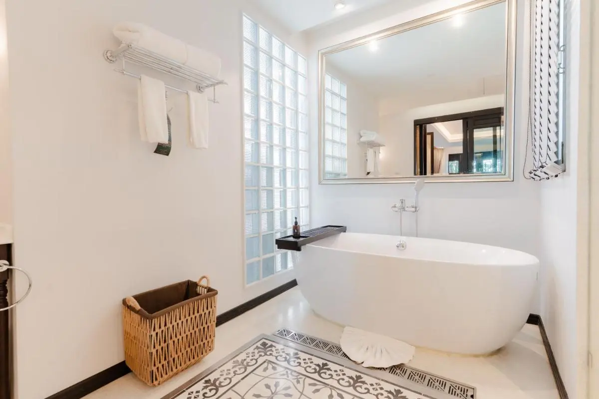 Modern Minimalist Bathroom with Freestanding Bathtub and Glass Blocks in Phra Sing Chiang Mai
