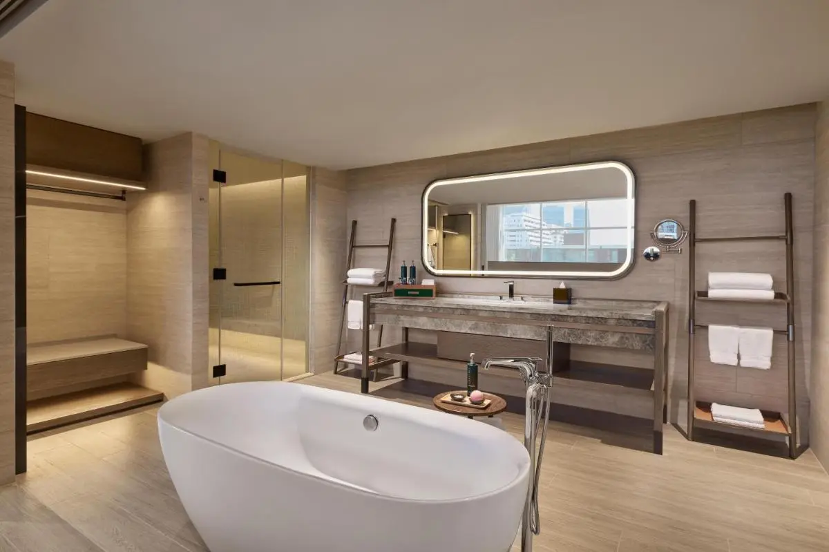 Modern Minimalist Bathroom with Freestanding Bathtub and Glass Shower in Khlong Toei