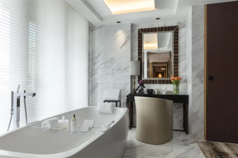 Modern Minimalist Bathroom with Freestanding Bathtub and Vanity in Pathumwan Bangkok