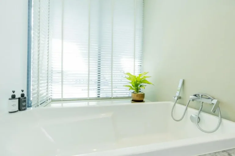 Modern Minimalist Bathroom with Rectangular Bathtub and Natural Light in Pathumwan