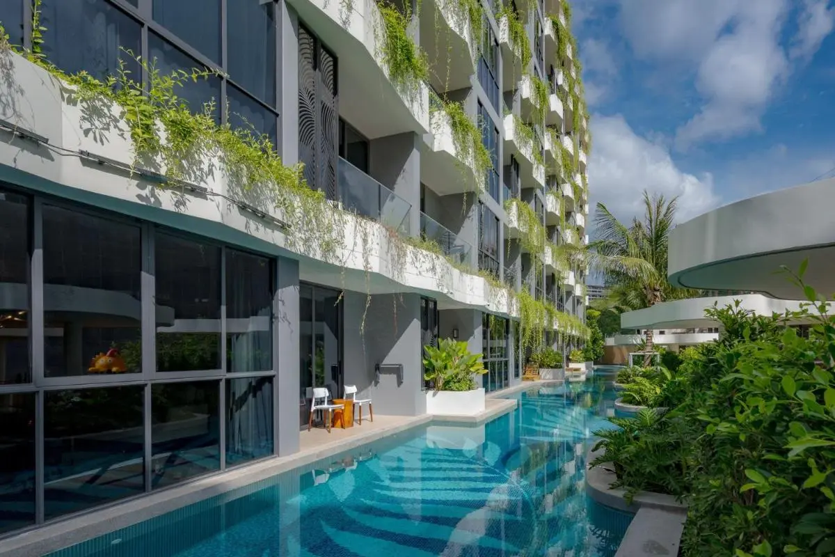 Modern Multi-Story Building Featuring Narrow Swimming Pool and Vertical Garden at Bang Tao Beach