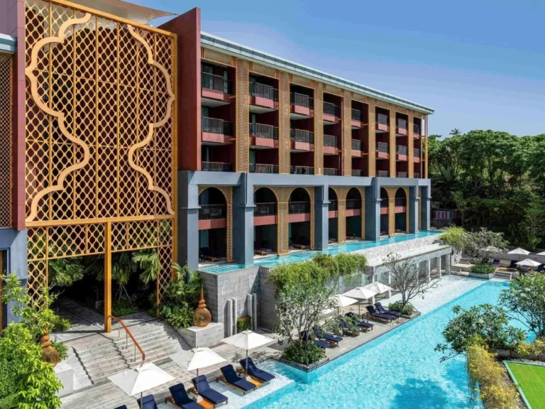 Modern Multi-Story Building with Dual Pools and Outdoor Lounge Areas at Karon Beach