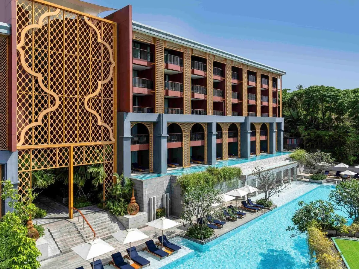 Modern Multi-Story Building with Dual Pools and Outdoor Lounge Areas at Karon Beach