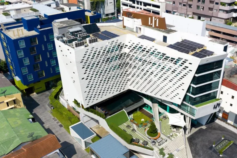 Modern Multi-Story Building with Pool and Outdoor Seating in Pathumwan Bangkok