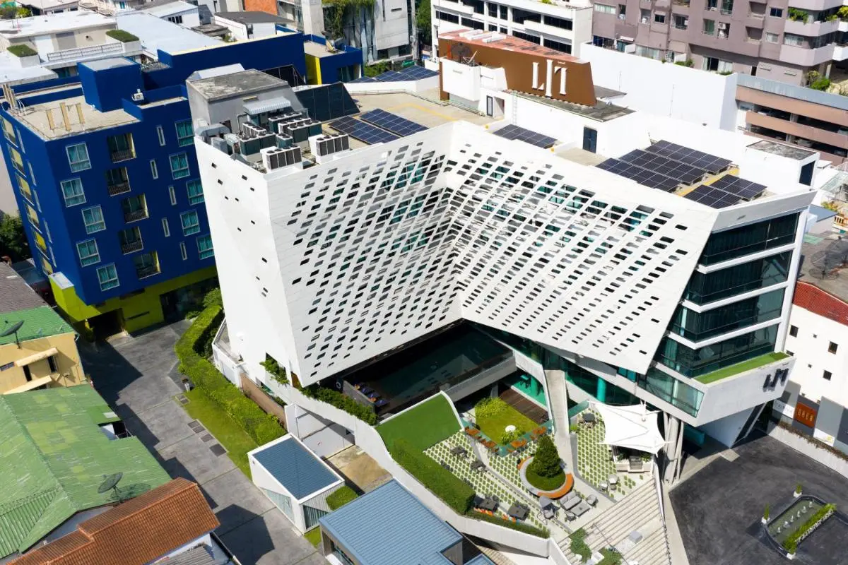 Modern Multi-Story Building with Pool and Outdoor Seating in Pathumwan Bangkok