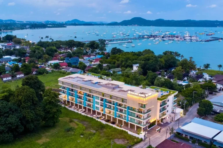 Modern Multi-Story Building with Rooftop Pools Overlooking Rawai Beach Marina