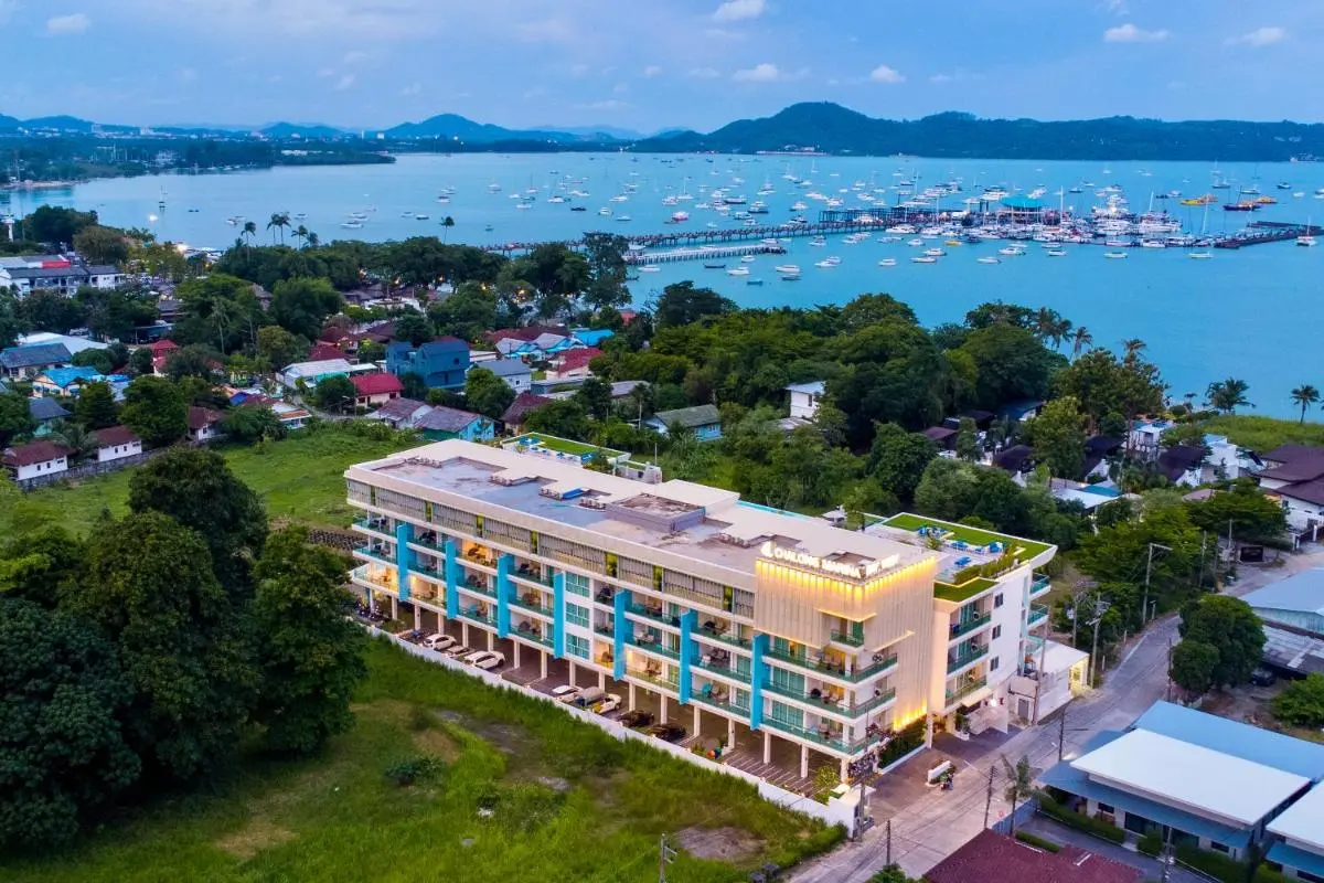 Modern Multi-Story Building with Rooftop Pools Overlooking Rawai Beach Marina