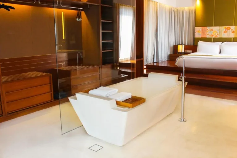 Modern Open-Plan Bedroom and Bathroom with Freestanding Bathtub in Pathumwan