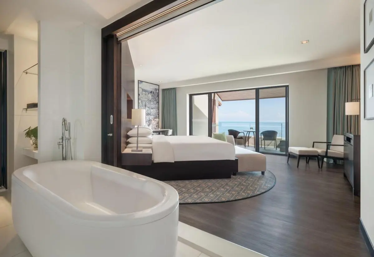 Modern Open-Plan Room with Freestanding Bathtub and Ocean View Balcony at Kamala Beach