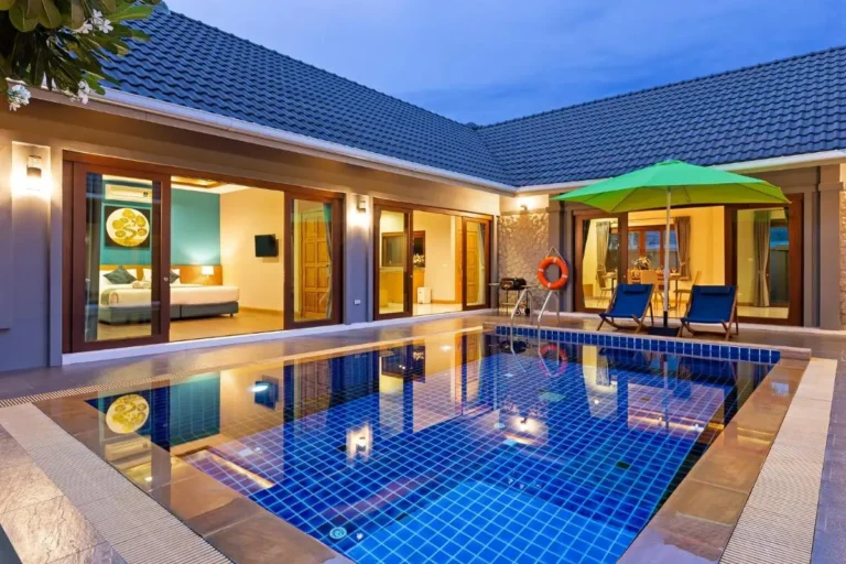 Modern Outdoor Courtyard with Swimming Pool and Lounge Area at Rawai Beach