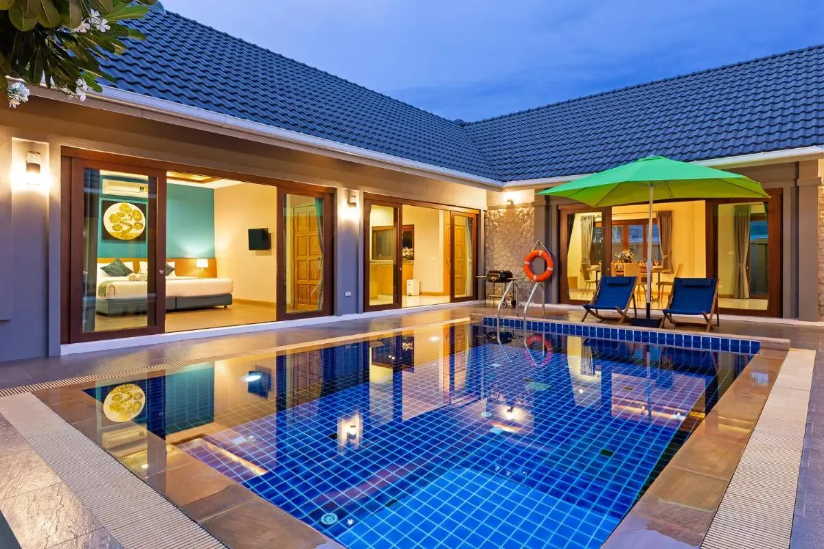 Modern Outdoor Courtyard with Swimming Pool and Lounge Area at Rawai Beach