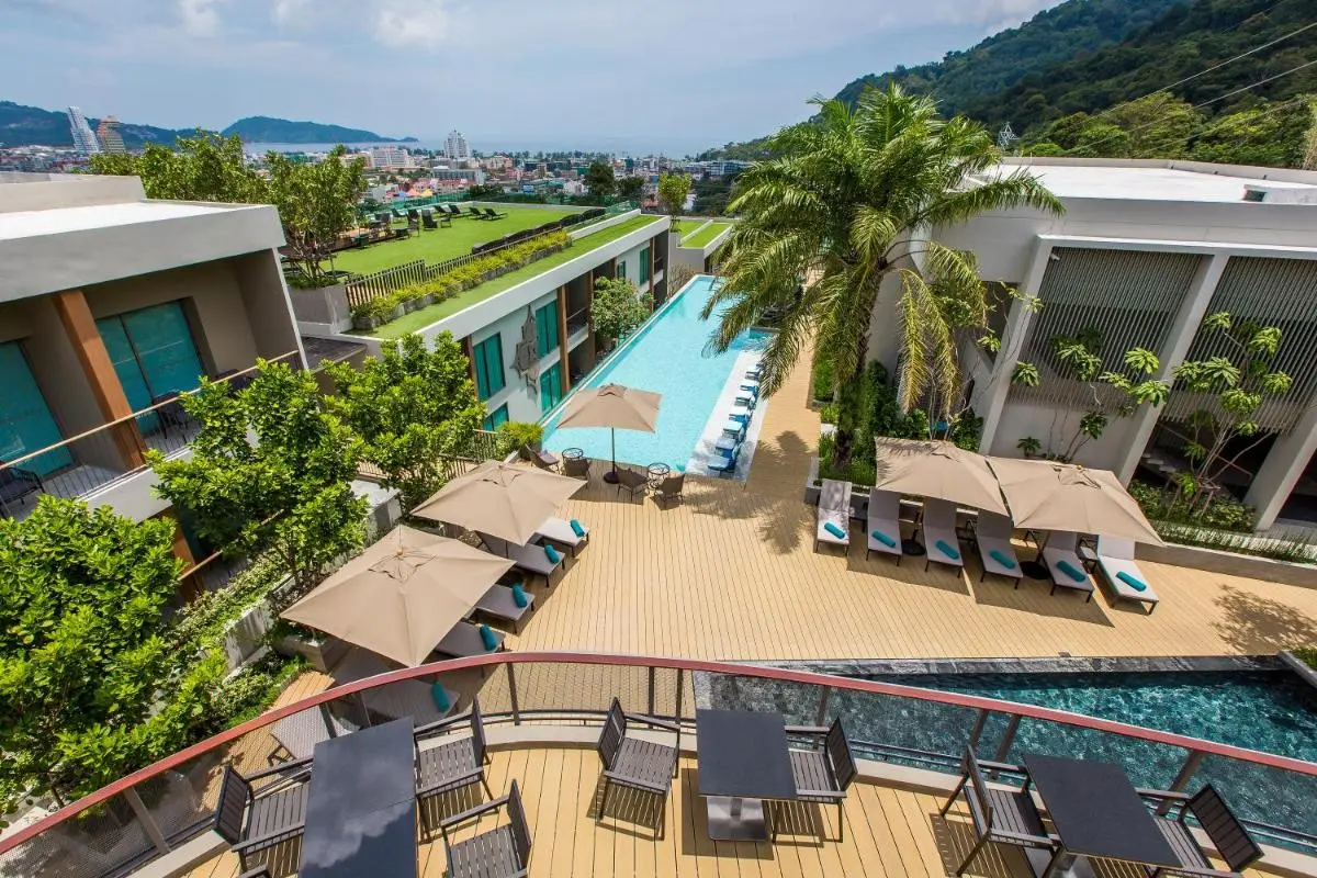AtEase Phuket Patong Modern Outdoor Pool and Relaxation Area with City and Sea Views at Patong Beach