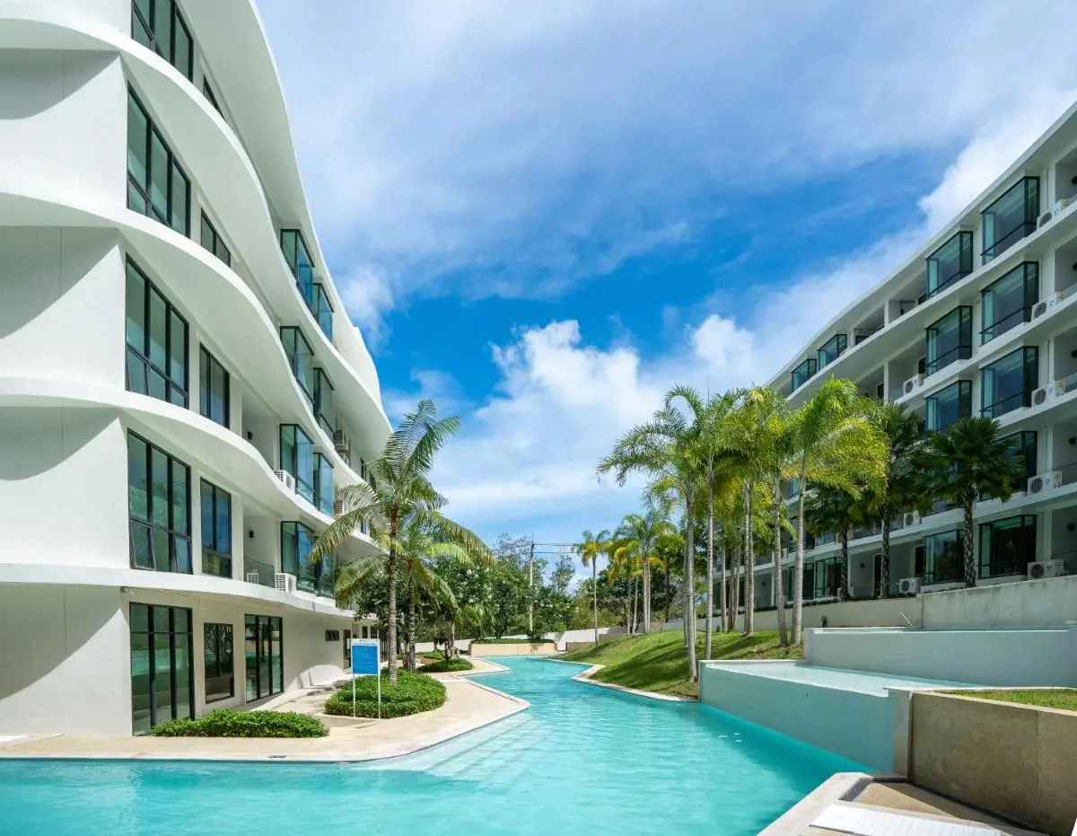 Modern Outdoor Pool Area Between Multi-Story Buildings Near Rawai Beach