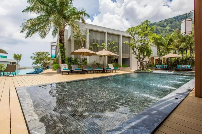Modern Outdoor Pool Area with Jacuzzi and Lounge Seating at Patong Beach