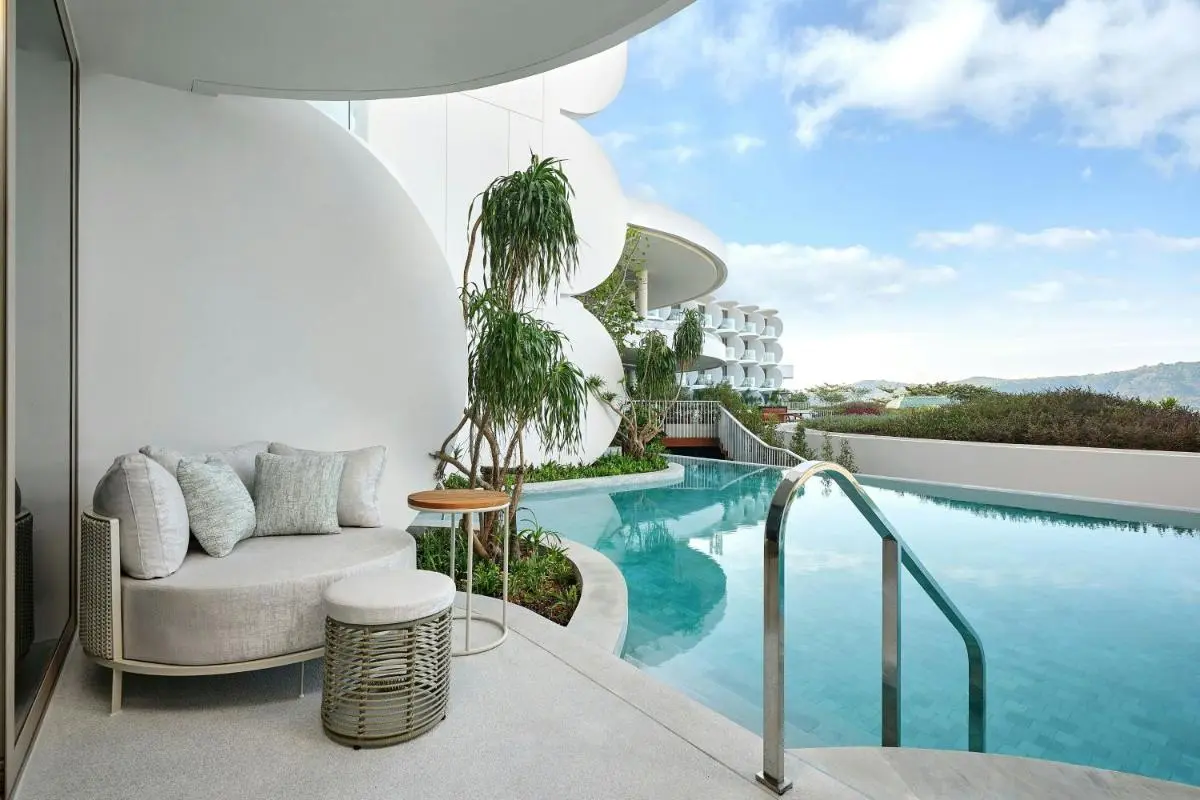 Modern Outdoor Pool Area with Rounded Architecture and Relaxing Seating at Panwa Beach