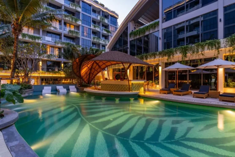 Modern Outdoor Pool Area with Swim-Up Bar and Tropical Landscaping at Bang Tao Beach