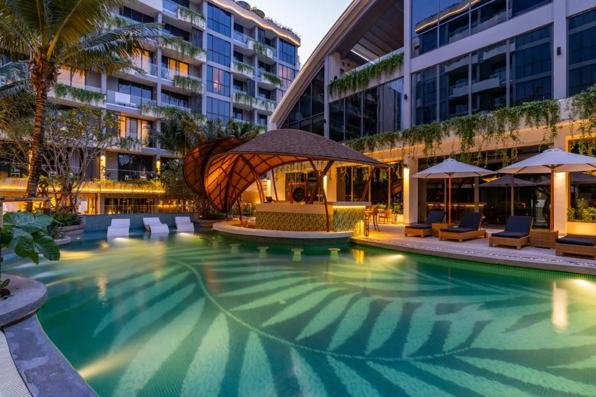 Modern Outdoor Pool Area with Swim-Up Bar and Tropical Landscaping at Bang Tao Beach