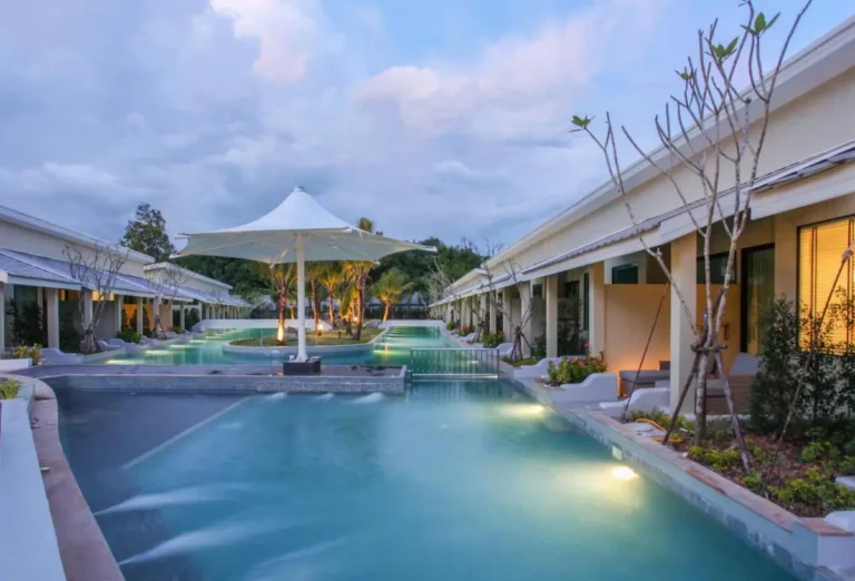 Modern Outdoor Pool Area with Water Features and Landscaped Gardens in Phuket Town