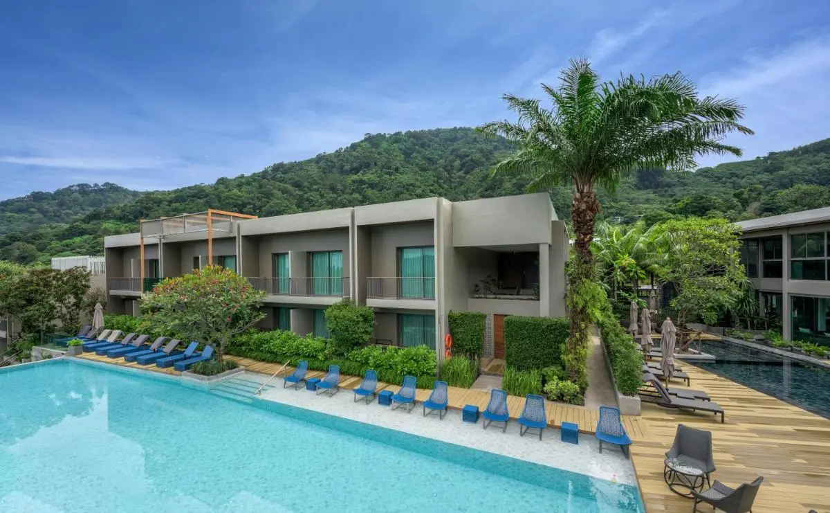 AtEase Phuket Patong Modern Outdoor Pools and Relaxation Area Surrounded by Lush Greenery in Patong Beach