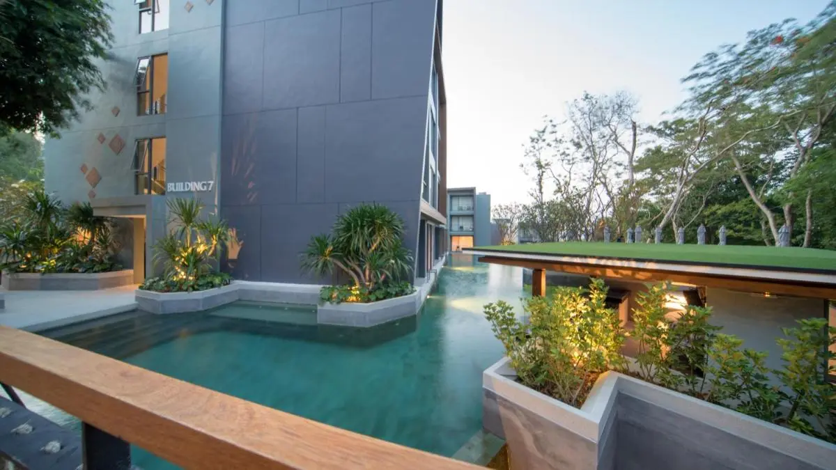 Modern Outdoor Rectangular Pool with Greenery and Sculptures at Patong Beach