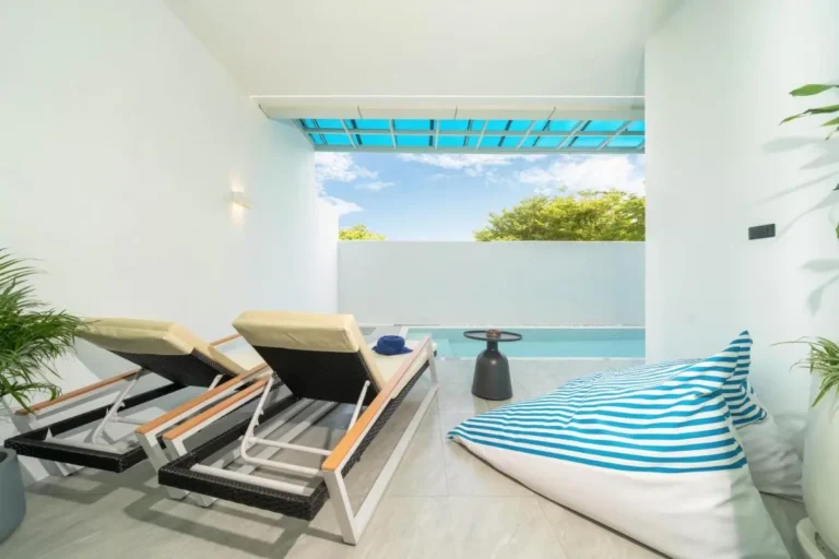 Modern Outdoor Relaxation Area Featuring Small Pool and Comfortable Seating at Rawai Beach