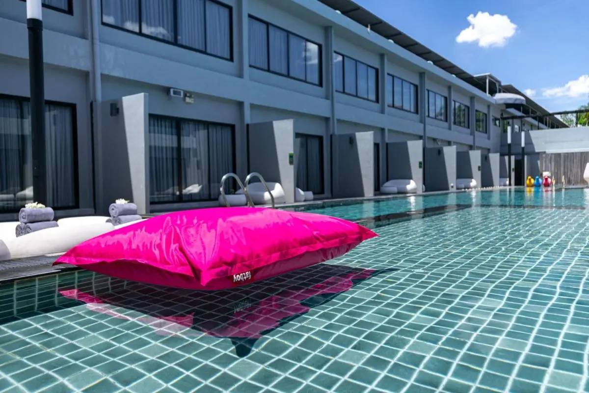 Modern Outdoor Swimming Pool and Lounge Area with Clear Water in Huai Khwang Bangkok