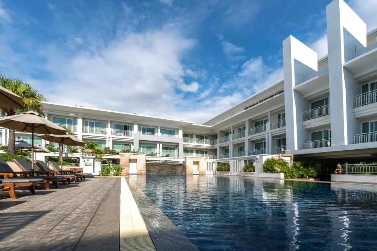 Modern Outdoor Swimming Pool and Lounge Area with Water Features in Chiang Mai City