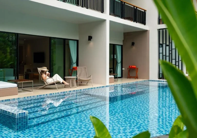 Modern Outdoor Swimming Pool and Patio Area with Lounge Seating at Mai Khao Beach