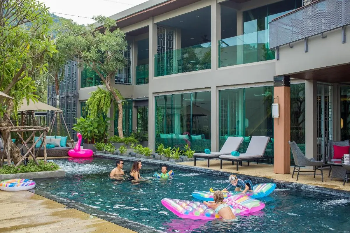 Modern Outdoor Swimming Pool and Relaxation Area with Jacuzzi Features at Patong Beach