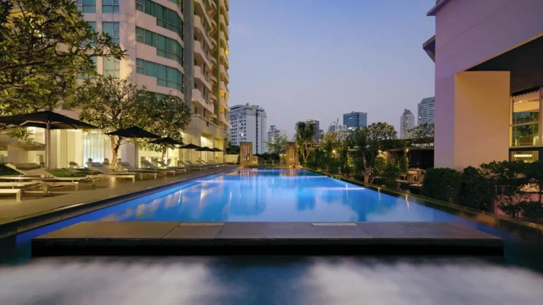 Modern Outdoor Swimming Pool and Water Feature in Sathorn Urban Setting