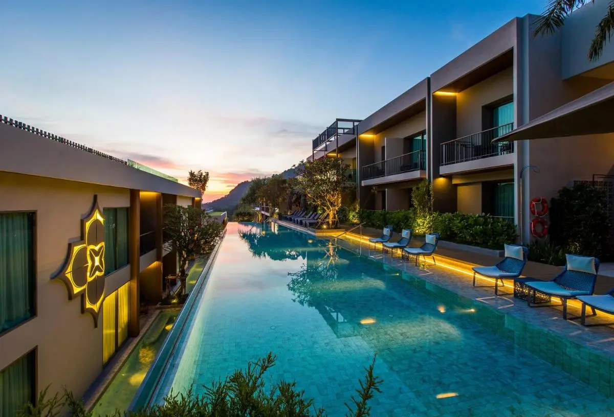 Modern Outdoor Swimming Pool with Lounge Area and Scenic Views at Patong Beach