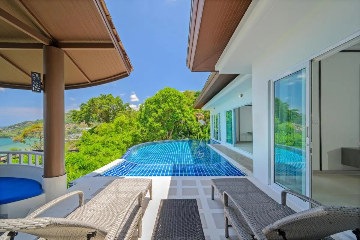 Phuket Province Modern Outdoor Terrace with Infinity Pool and Lounge Seating Overlooking Natural Landscape at Patong Beach