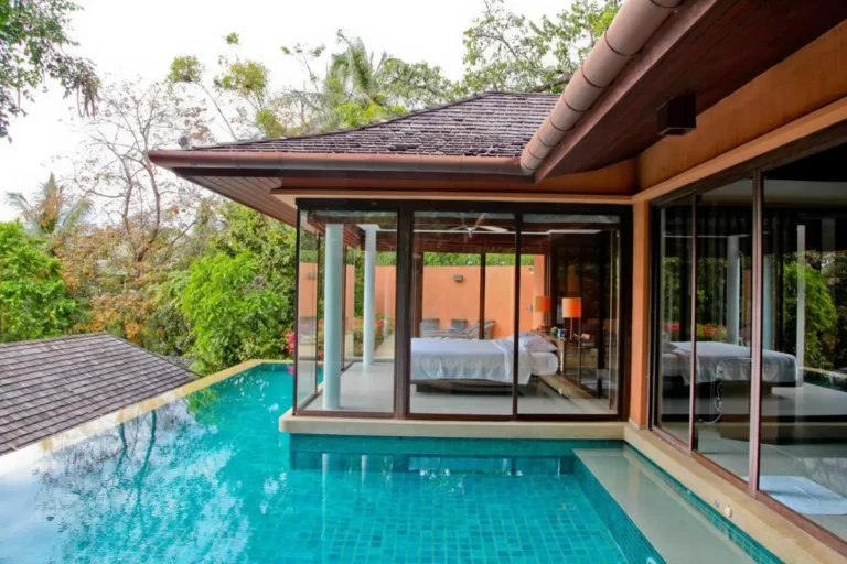 Modern Private Outdoor Infinity Pool Adjacent to Bedroom with Glass Walls at Panwa Beach