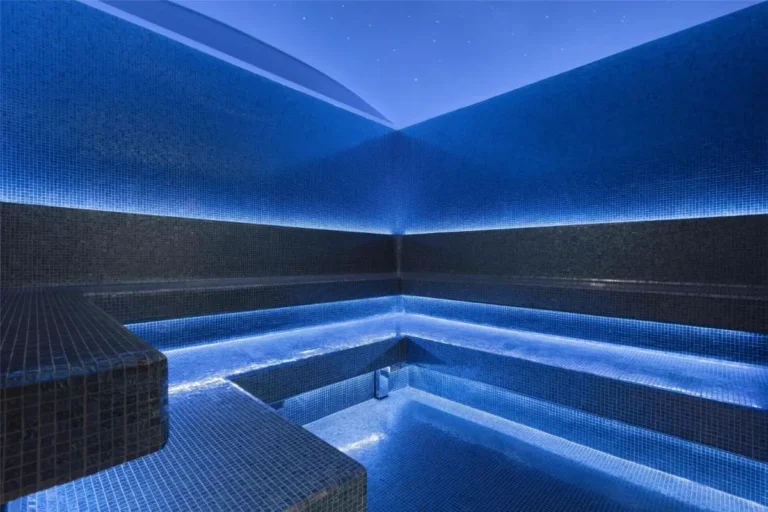 Modern Relaxation Room with Blue Mosaic Tiles and Ambient Lighting in Pathumwan