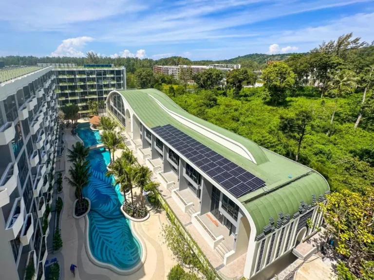 Modern Residential Complex with Central Pool and Green Roof at Bang Tao Beach
