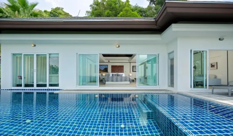 Modern Residential Outdoor Area Featuring Rectangular Swimming Pool with Glass Doors