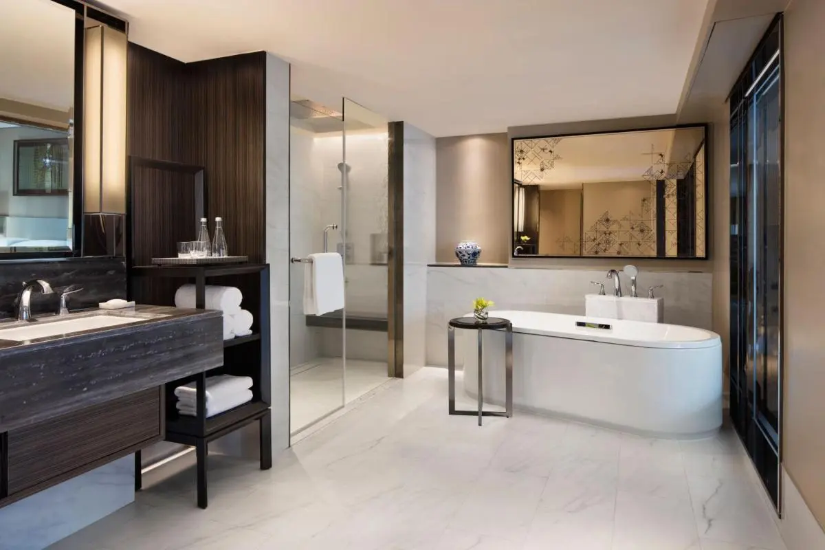 Modern Spacious Bathroom with Marble Tiles and Freestanding Tub in Khlong Toei