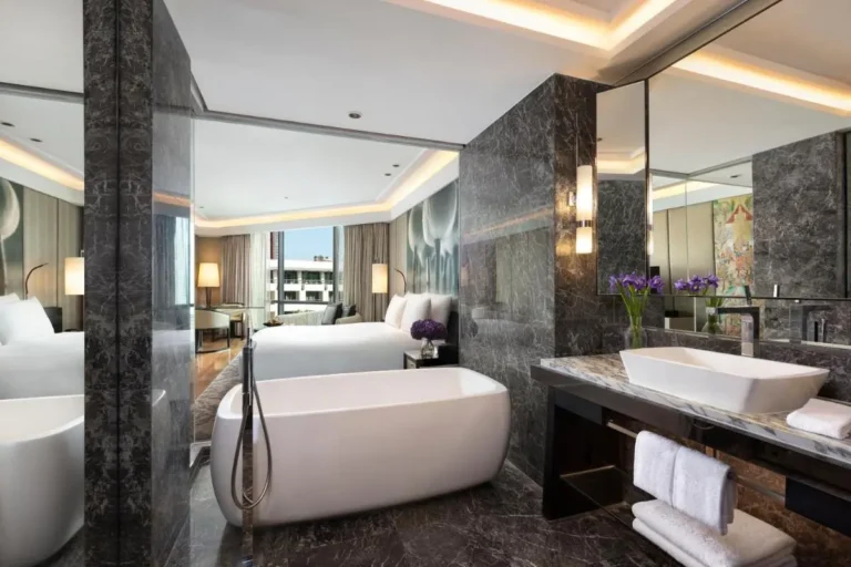 Modern Urban Hotel Room with Freestanding Bathtub and Marble Bathroom in Pathumwan