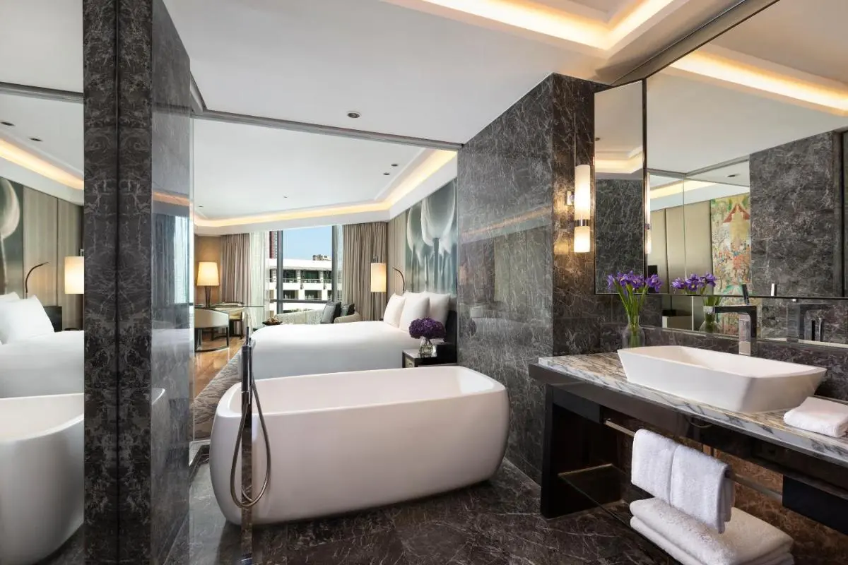 Modern Urban Hotel Room with Freestanding Bathtub and Marble Bathroom in Pathumwan