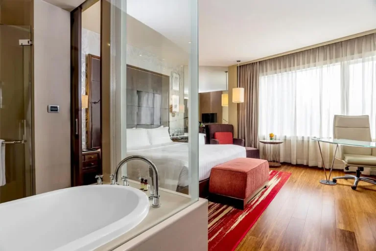 Modern Wattana Hotel Room Featuring Oval Bathtub and Contemporary Interior Design