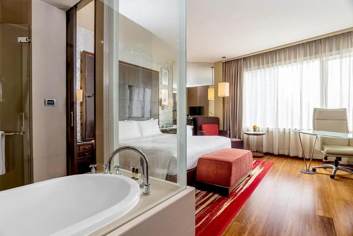 Modern Wattana Hotel Room Featuring Oval Bathtub and Contemporary Interior Design