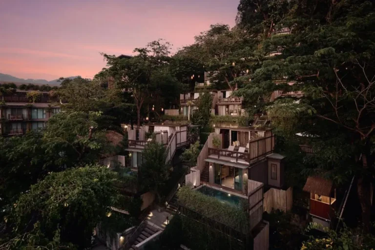 Multi-Level Hillside Complex with Private Pools and Natural Wood Architecture at Dusk