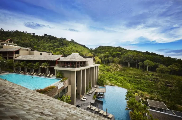 Multi-Level Outdoor Pools and Infinity Pool Overlooking Forested Hills at Patong Beach