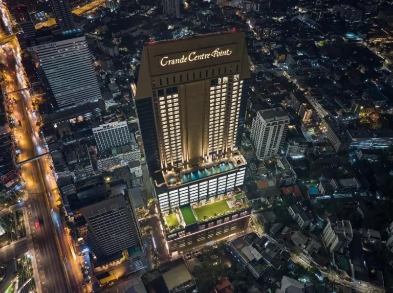 Nighttime Aerial View of High-Rise Building with Rooftop Pool and Jacuzzi in Sathorn Bangkok Nighttime Aerial View of High-Rise Building with Rooftop Pool and Jacuzzi in Sathorn Bangkok