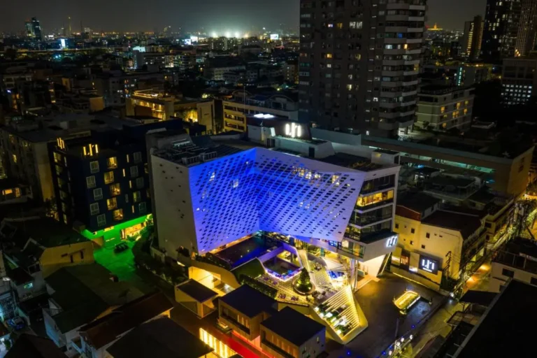 Nighttime Urban View with Modern Building Featuring Illuminated Pools in Pathumwan Bangkok Nighttime Urban View with Modern Building Featuring Illuminated Pools in Pathumwan Bangkok