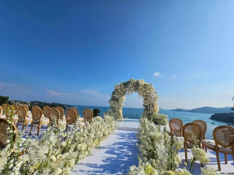 Outdoor Ceremony Setup Overlooking Panwa Beach with Floral Arch and Ocean Views