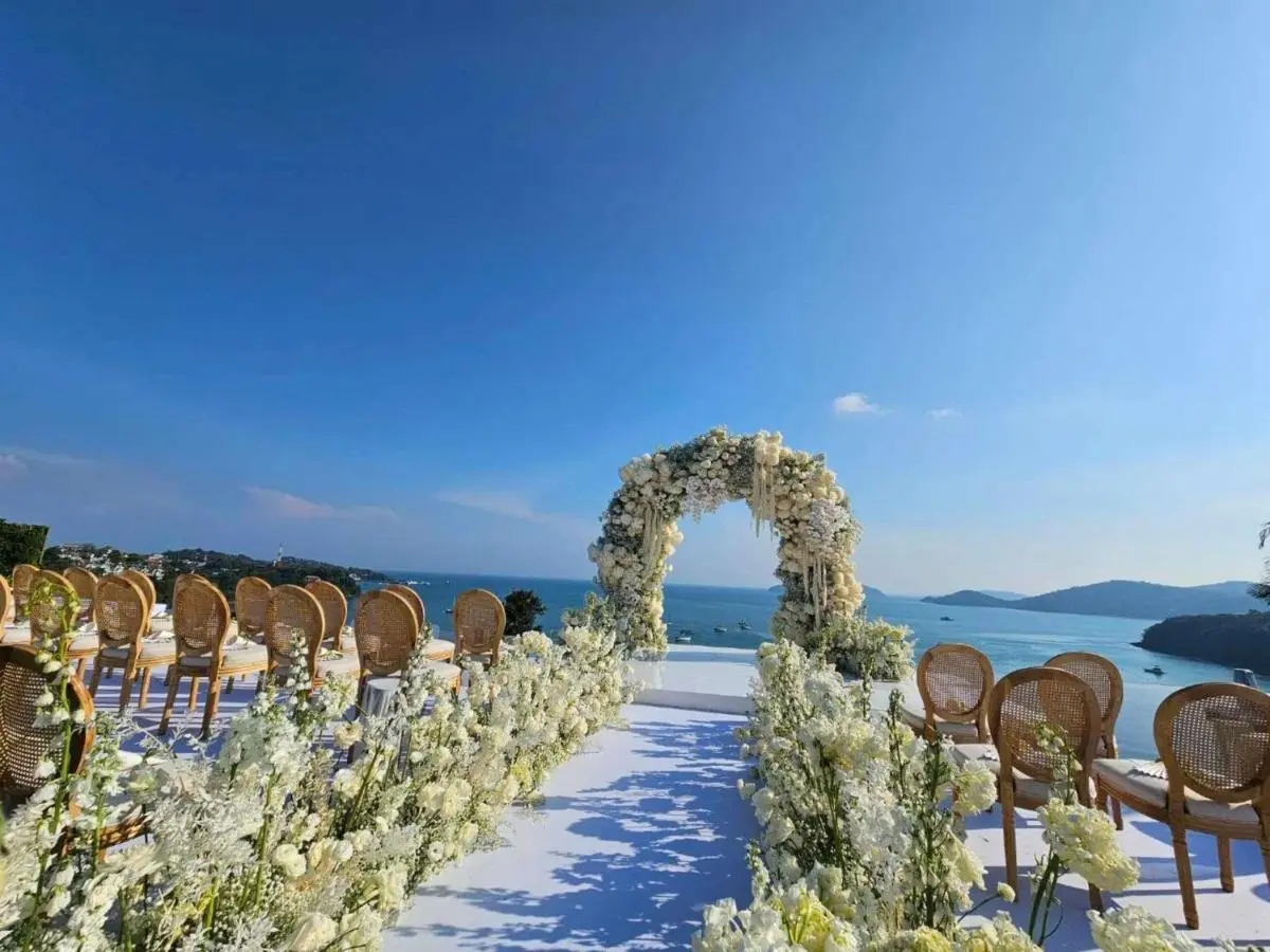 V Villas Phuket - MGallery Collection Outdoor Ceremony Setup Overlooking Panwa Beach with Floral Arch and Ocean Views Phuket Province