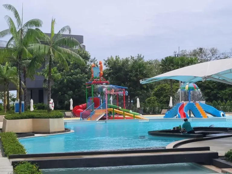 Outdoor Children’s Pool Area with Colorful Water Slides and Tropical Landscaping at Rawai Beach