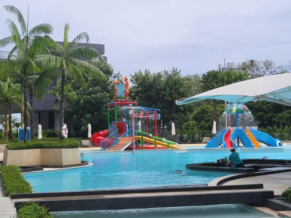 Outdoor Children’s Pool Area with Colorful Water Slides and Tropical Landscaping at Rawai Beach